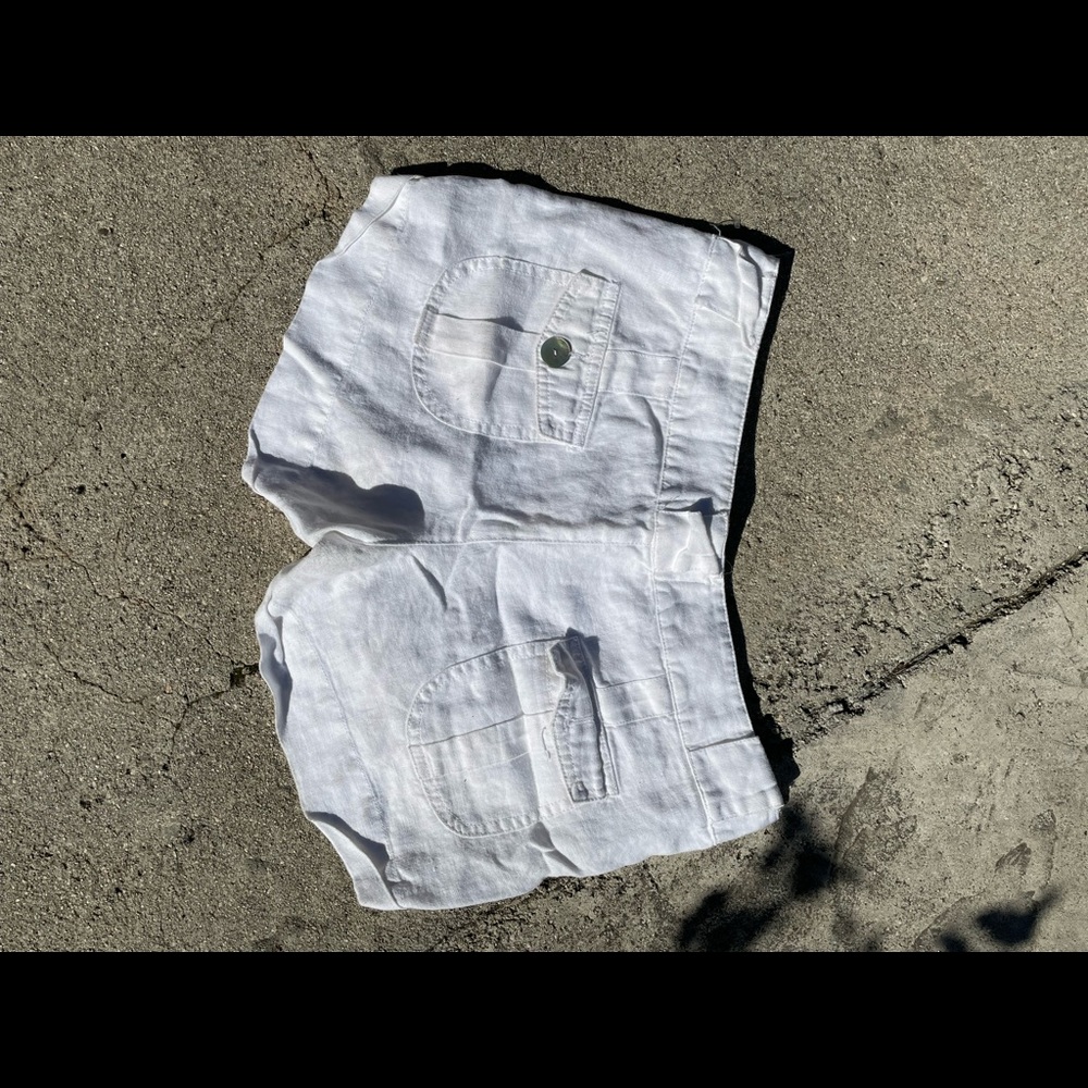 White linen shorts, pearl buttons